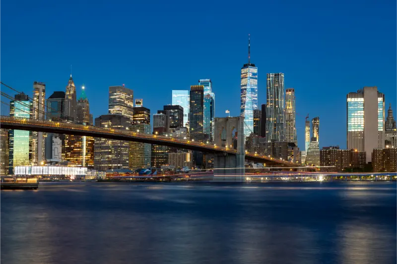Brooklyn Bridge and Lower Manhattan skyline at dawn