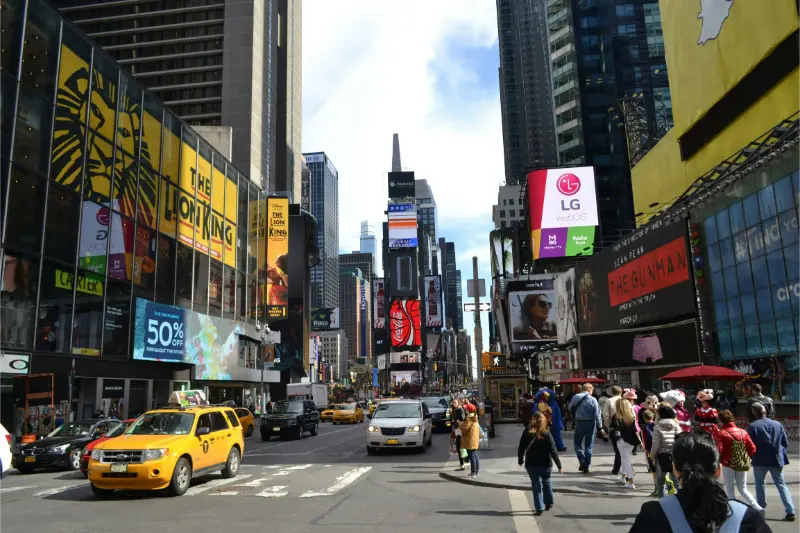 Times Square With A Yellow Taxi In Daylight