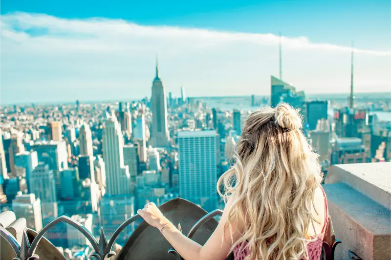 Woman Overlooking Manhattan From Top Of The Rock